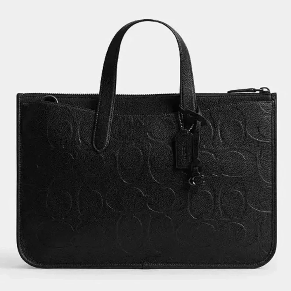 Coach Isaac WorkbagIn Maxi Signature Leather New with tags and dust bag.